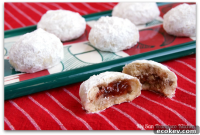 Jam-Filled Snowball Cookies: Raspberry-Stuffed Holiday Shortbreads