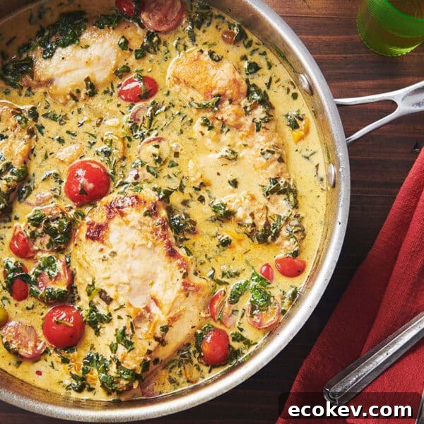 Creamy Tuscan Chicken in skillet on table.