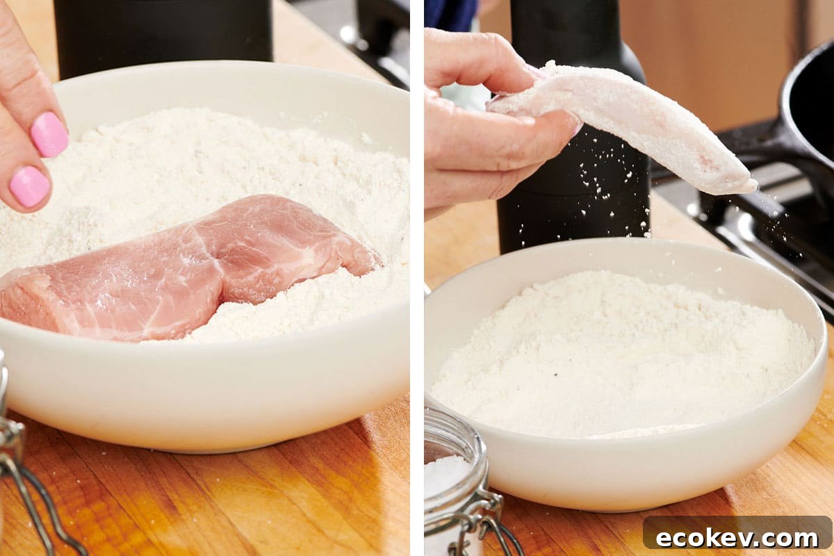 Dredging chicken in bowl of flour.