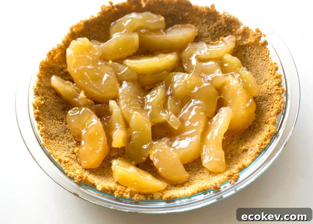 Caramel Apple Cheesecake - the easiest cheesecake with a graham cracker crust, apples, caramel, and nuts.