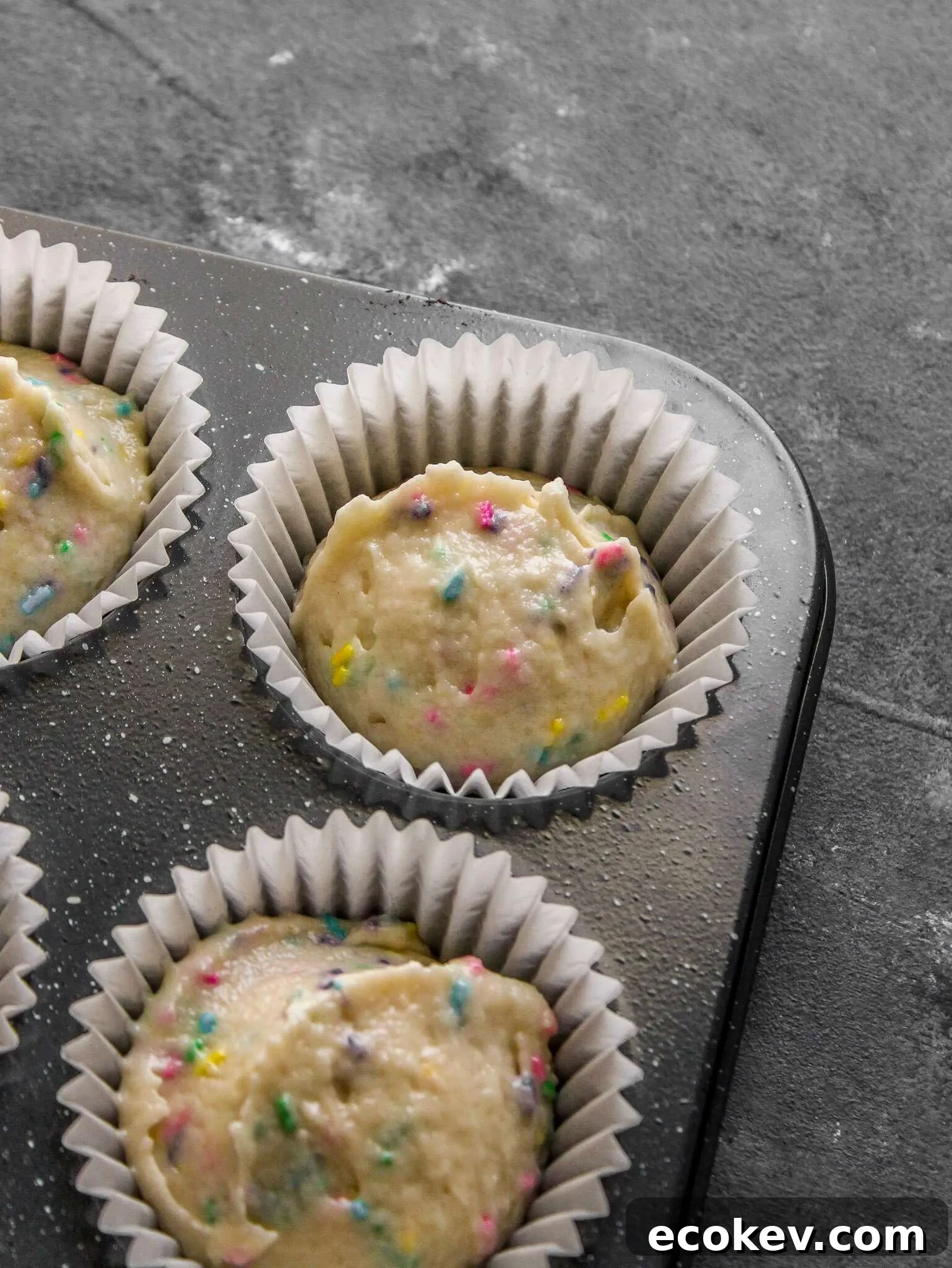 funfetti cupcakes batter portioned into cupcake tin (2)