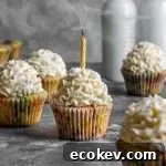 frosted funfetti cupcakes with candle in one cupcake blown out (1)