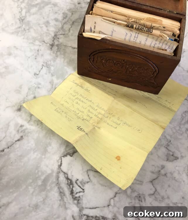 recipe box with yellow paper showing hand written recipe