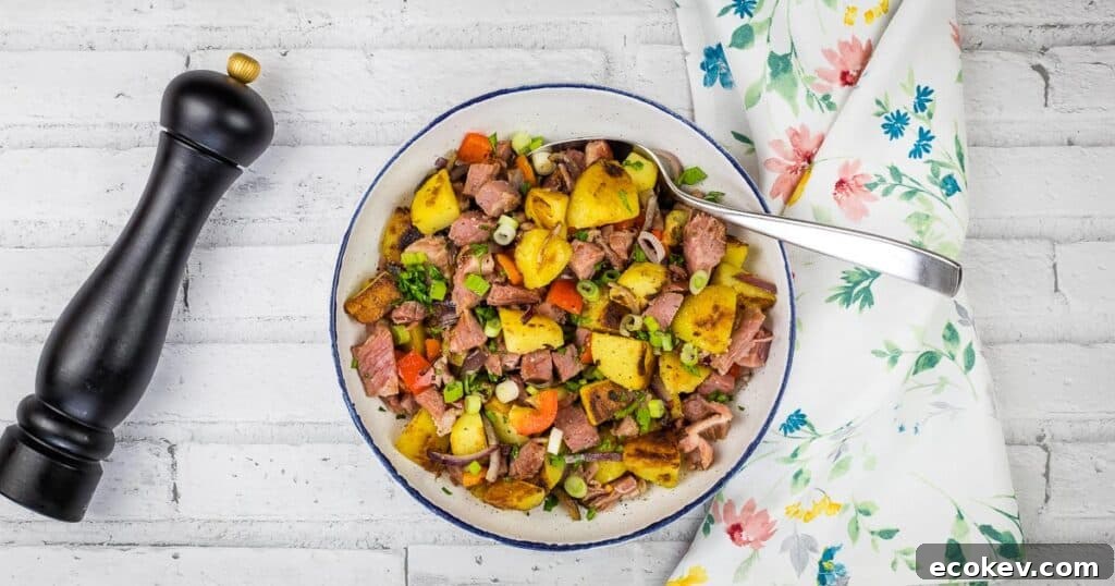 A bowl of leftover cottage roll hash on a white tablecloth.
