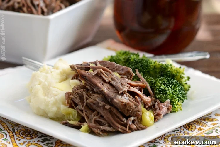 instant pot mississippi chuck roast on plate with mashed potatoes and broccoli