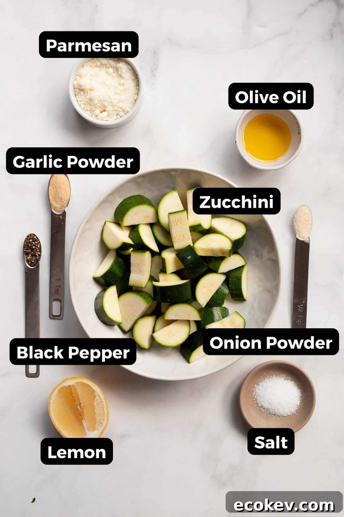 All ingredients labeled in small bowls, including zucchini, olive oil, grated Parmesan cheese, garlic powder, onion powder, salt, and black pepper.