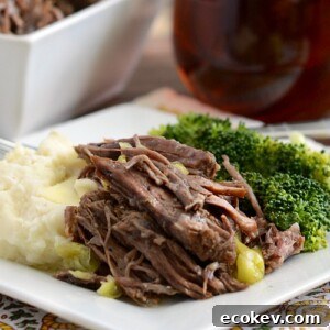 instant pot mississippi chuck roast on plate with mashed potatoes and broccoli