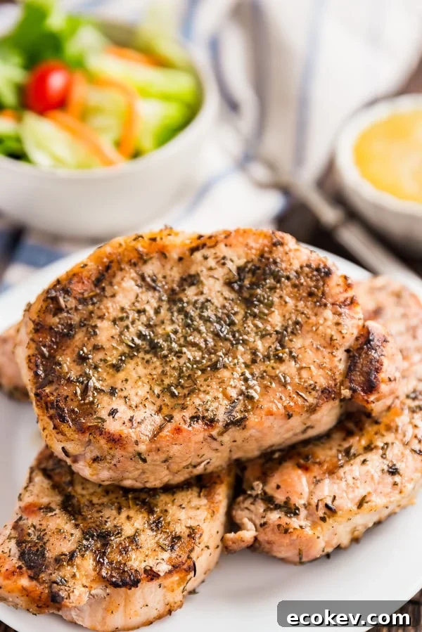 Herb Grilled Pork Chops are my absolute favorite way to enjoy grilled pork chops. Super quick and easy to make and mouthwateringly delicious (especially when dipped in applesauce!).