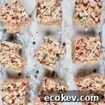 Rice Krispy Treats lined 3x3 with Christmas sprinkles