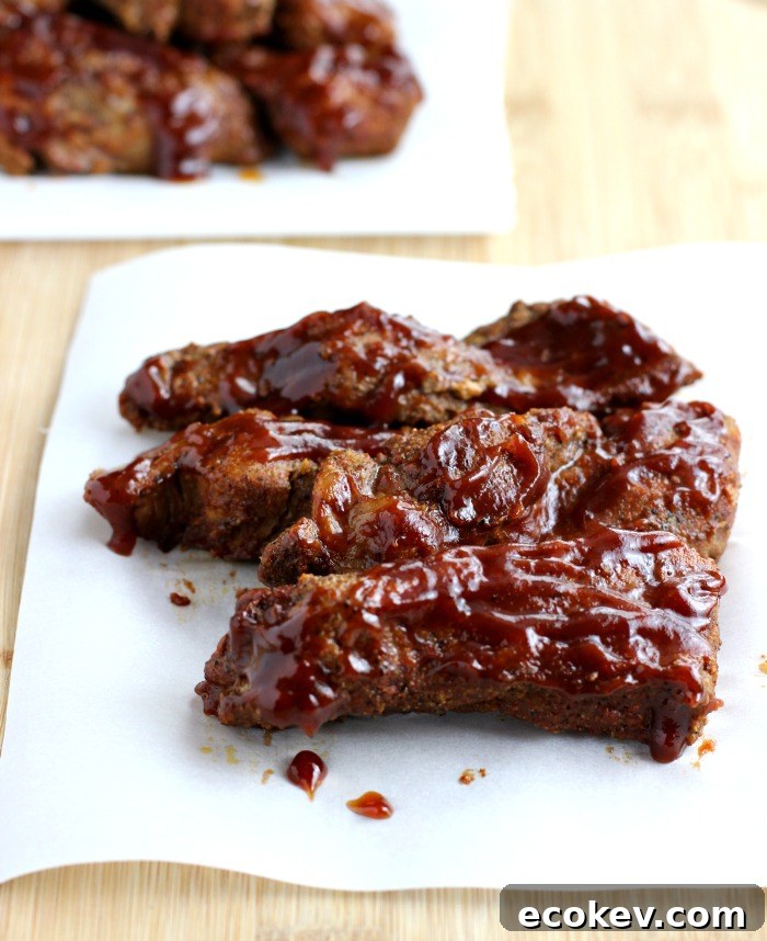 brushing sauce on ribs