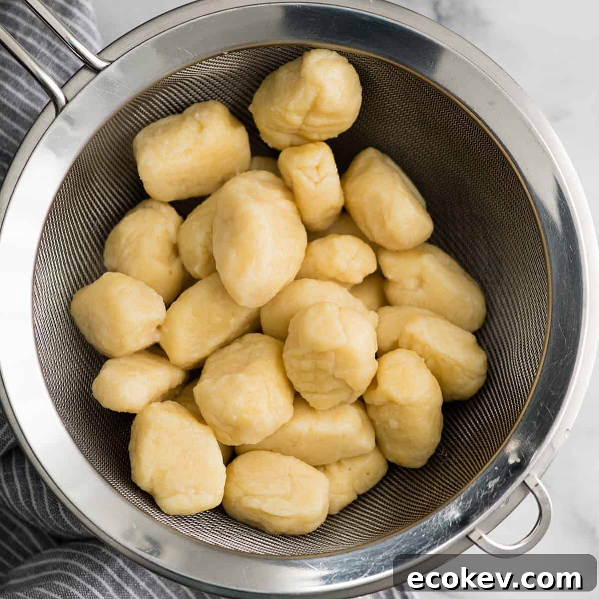 gnocchi after boiling draining in a colander