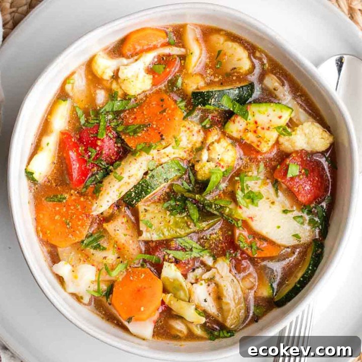 Colorful and chunky roasted veggies in an reddish brown broth.