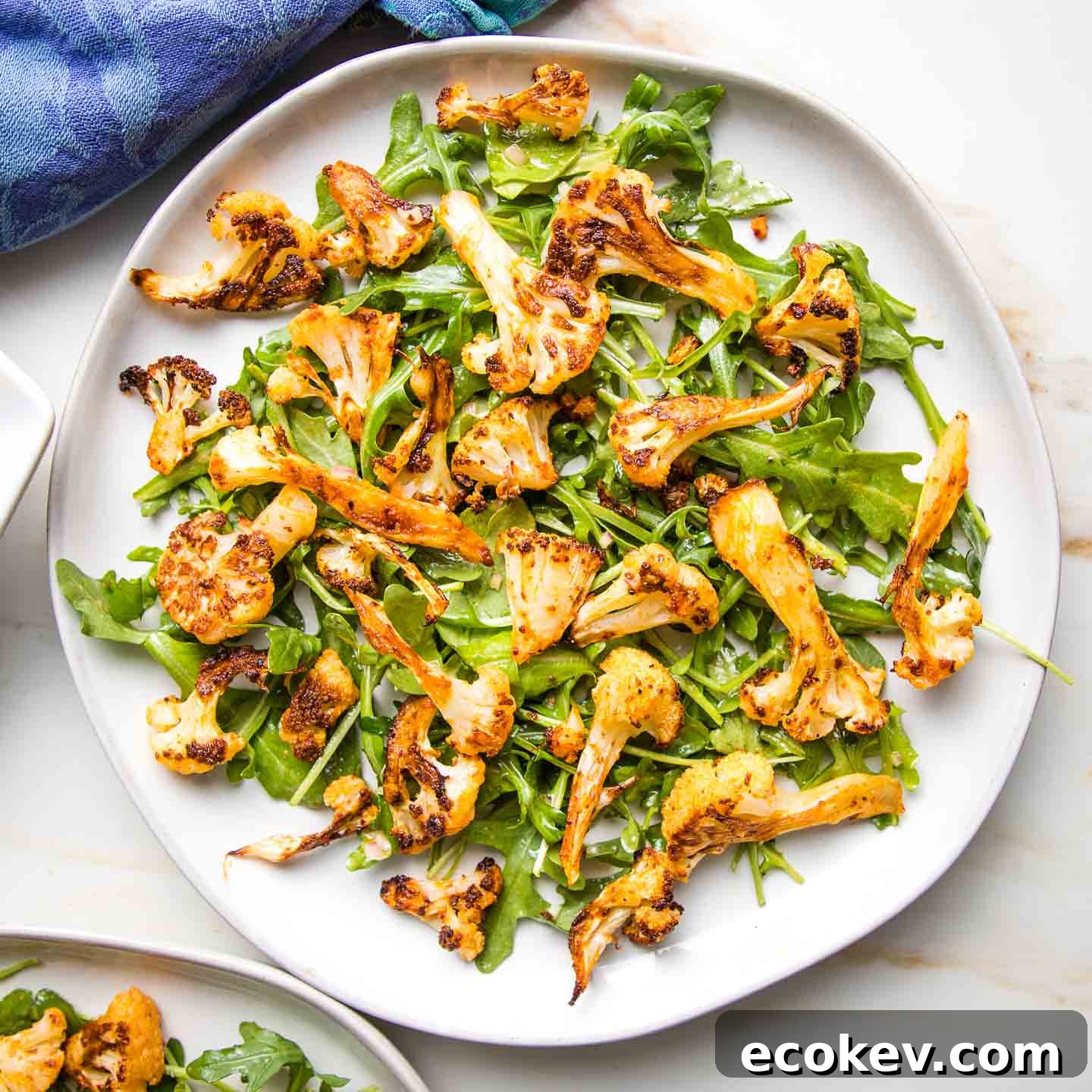 Roasted cauliflower florets over a simple arugula salad.
