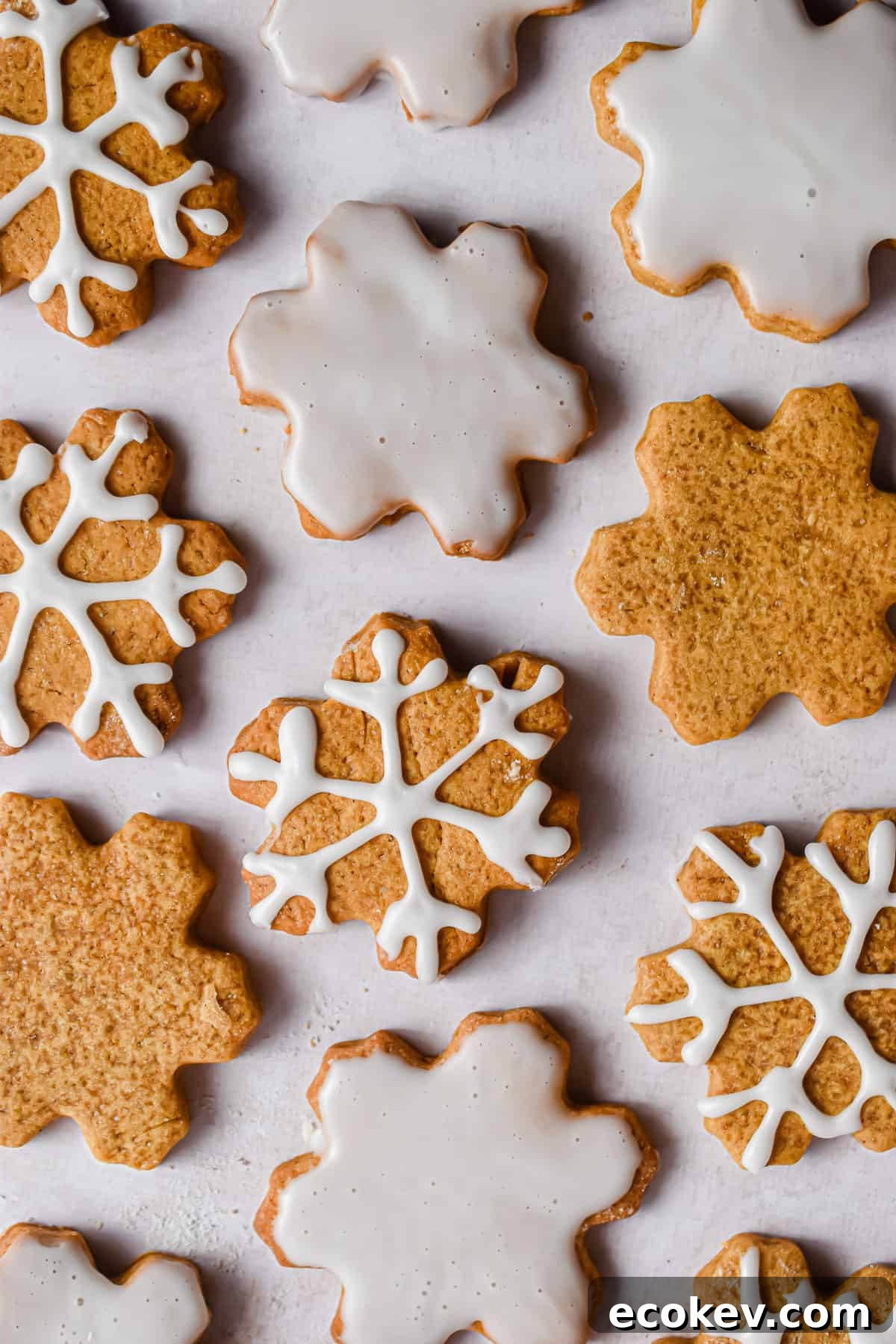 Snowflake cookies are decorated with icing.
