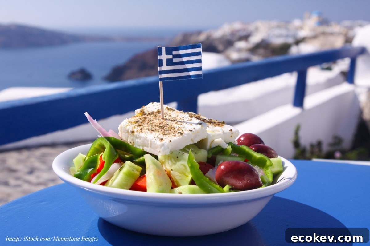greek salad with a greek flag pick on a blue table overlooking an ocean sean