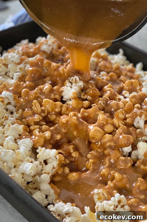 pouring sugary golden sauce over popped corn