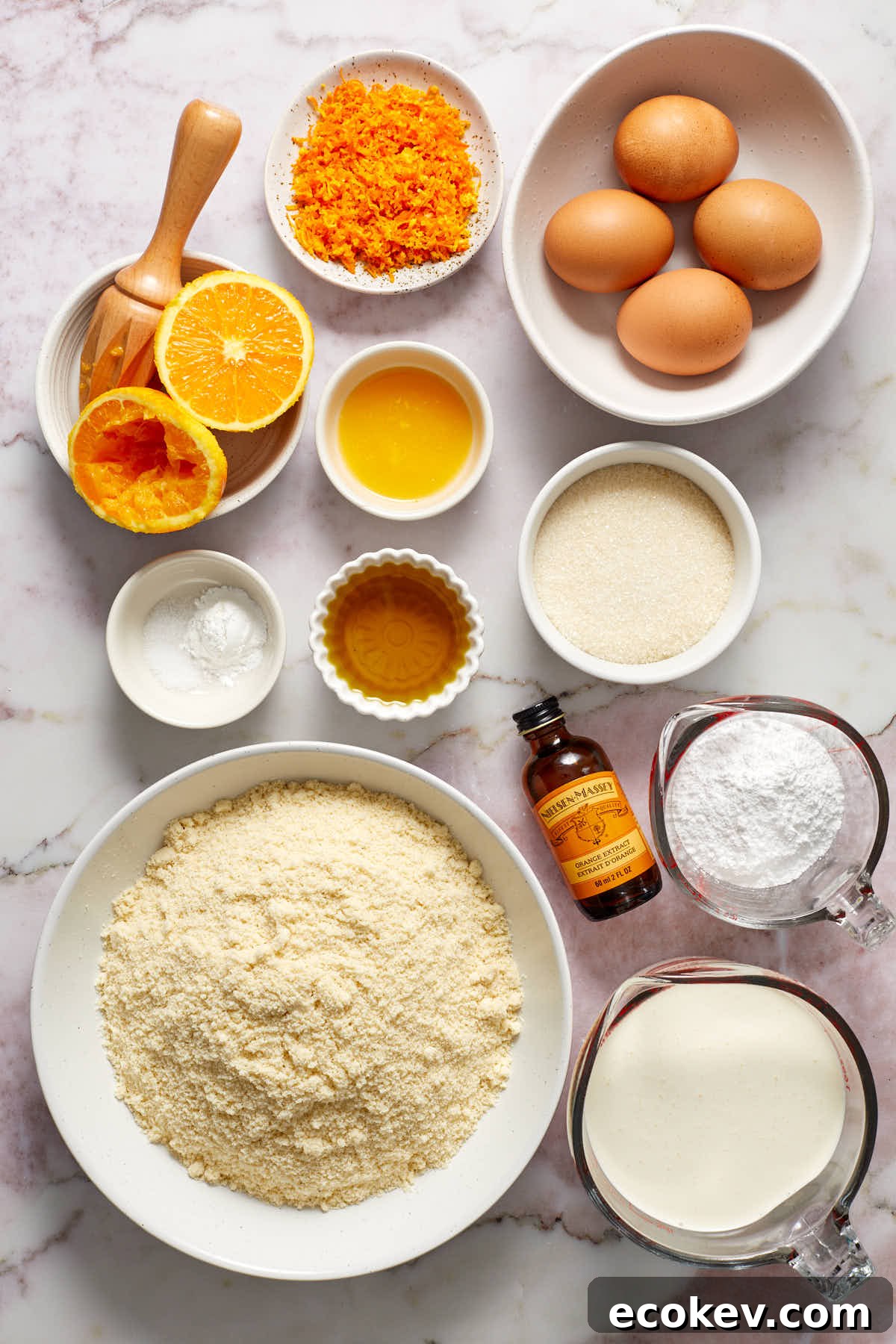 Ingredients to make almond flour orange cake arranged in individual bowls.
