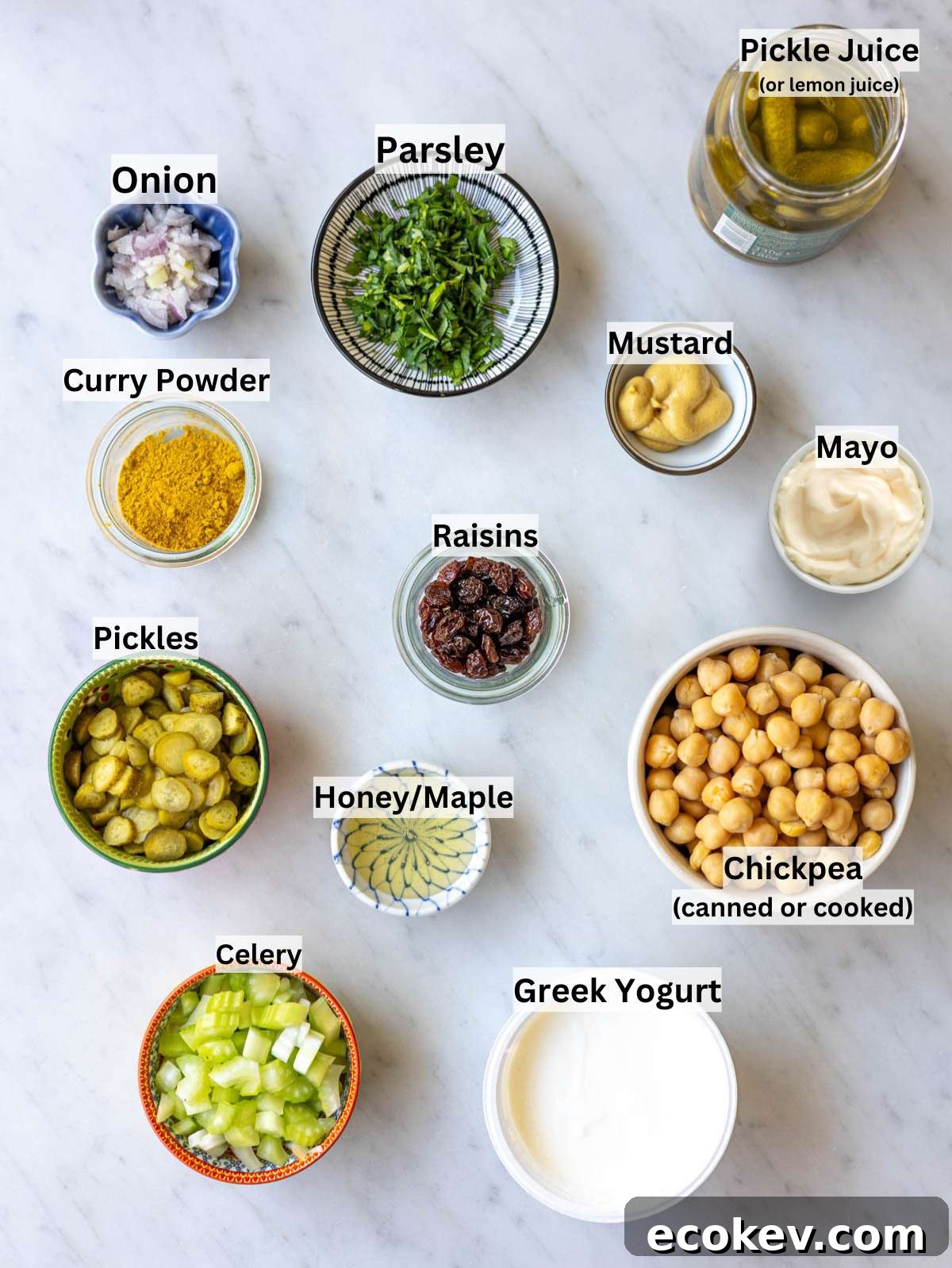Close up spoonful of lentil noodle soup with pasta and Canned chickpeas, Greek yogurt, celery, pickles, mustard, honey, curry powder on table.