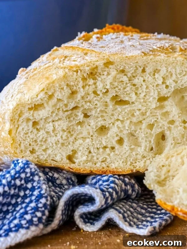 sliced artisan bread loaf on a cutting board