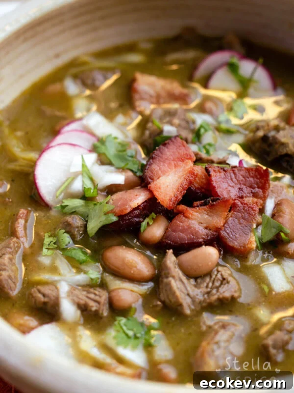 a bowl of hot carne en su jugo with toppings