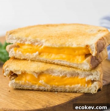 Air Fryer Grilled Cheese sandwich placed on a wooden board
