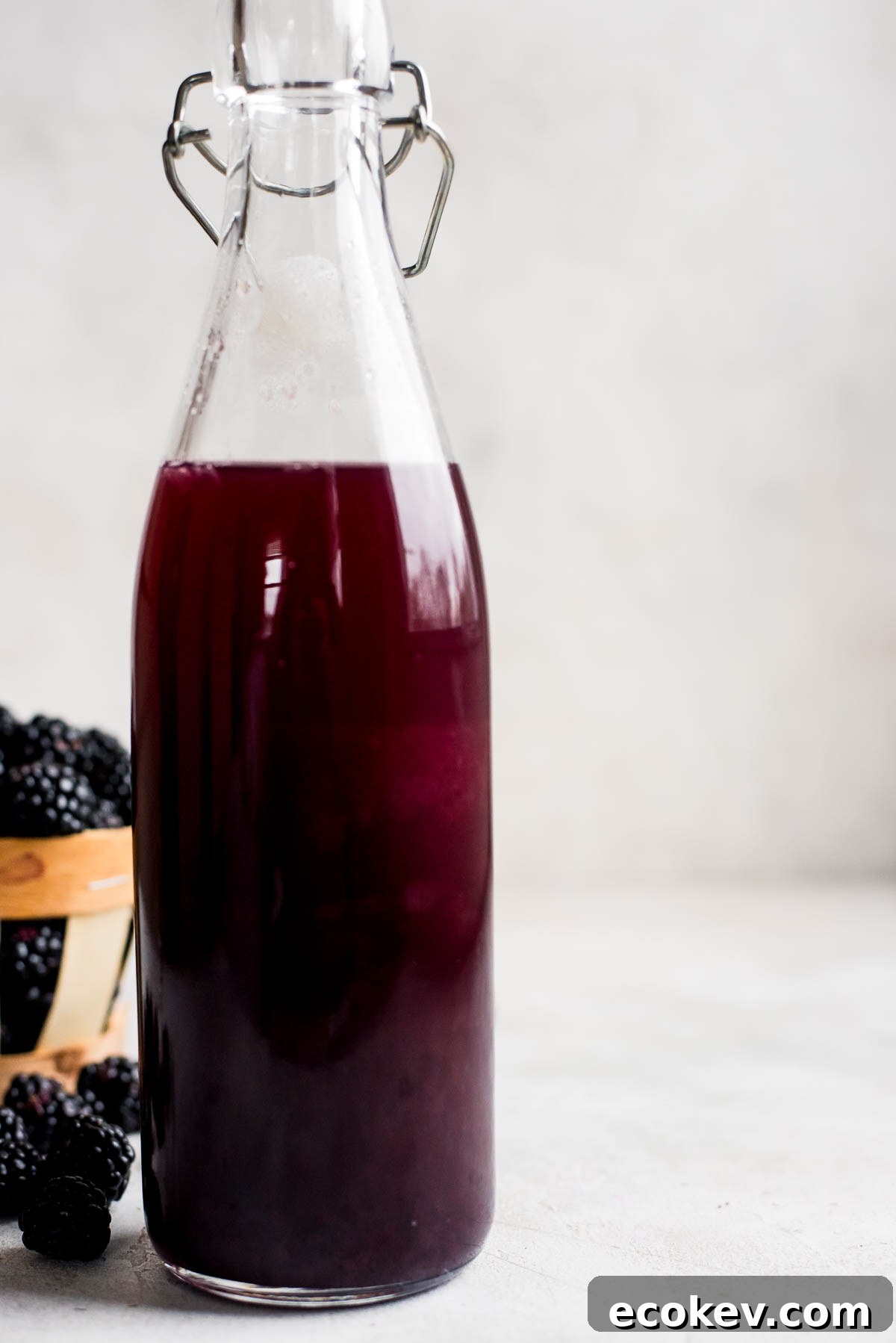close up of blackberry syrup in bottle