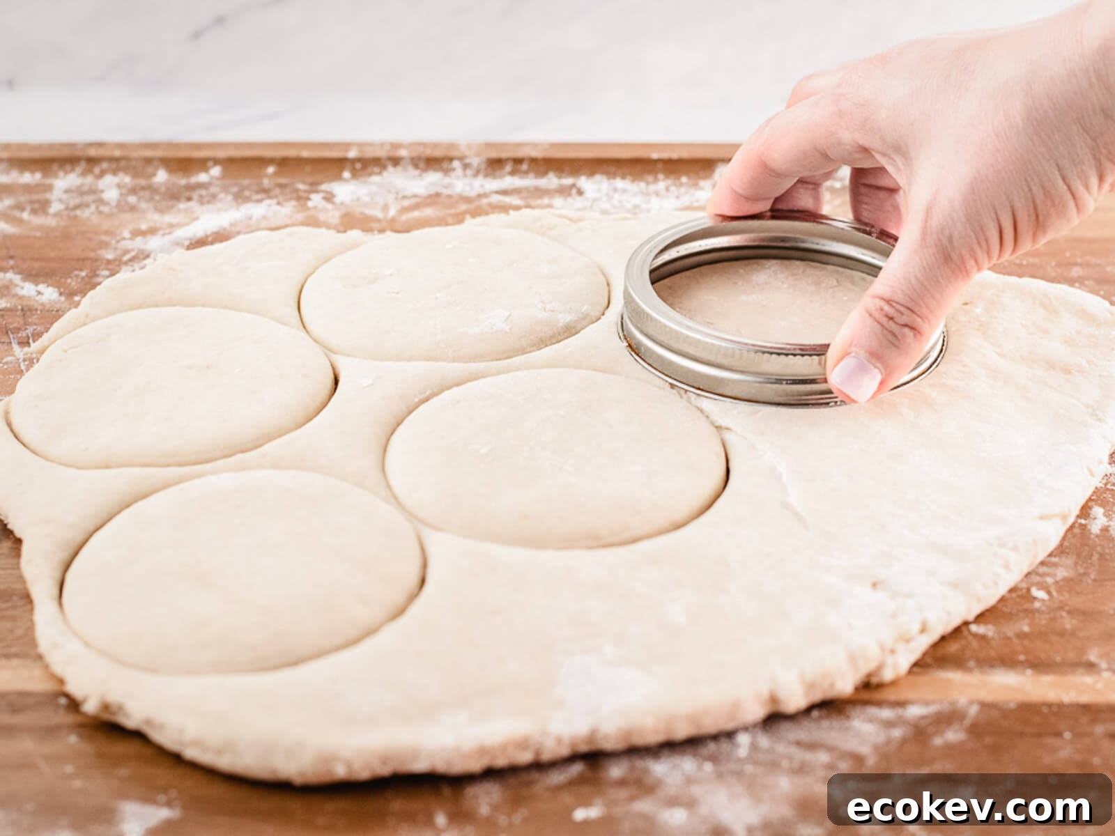 Use a mason jar lid to cut out English muffins.
