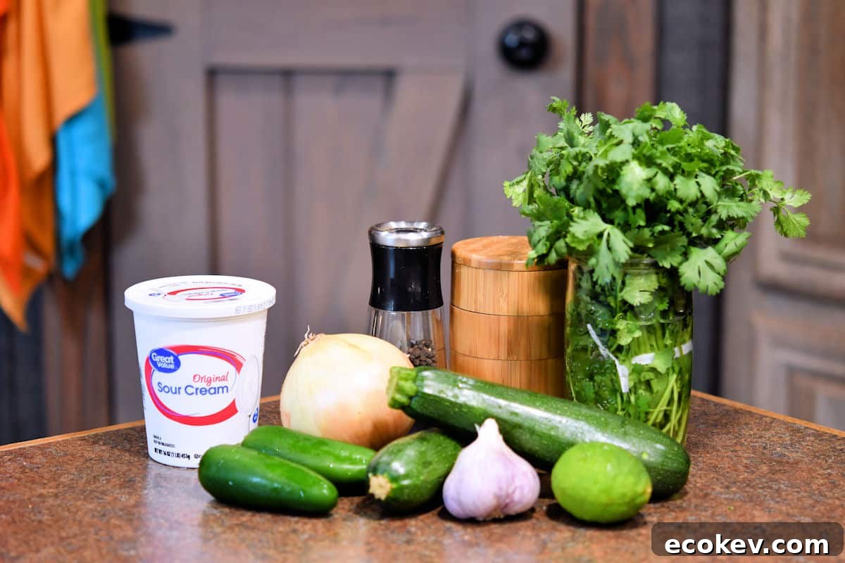 fresh ingredients for zucchini pasta sauce on a countertop