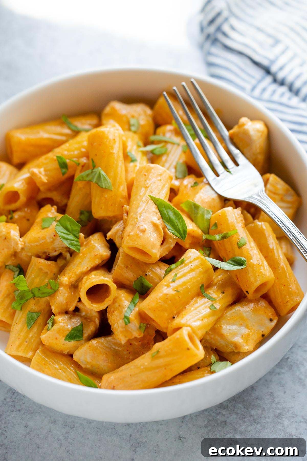 Peri peri pasta in a bowl with a fork