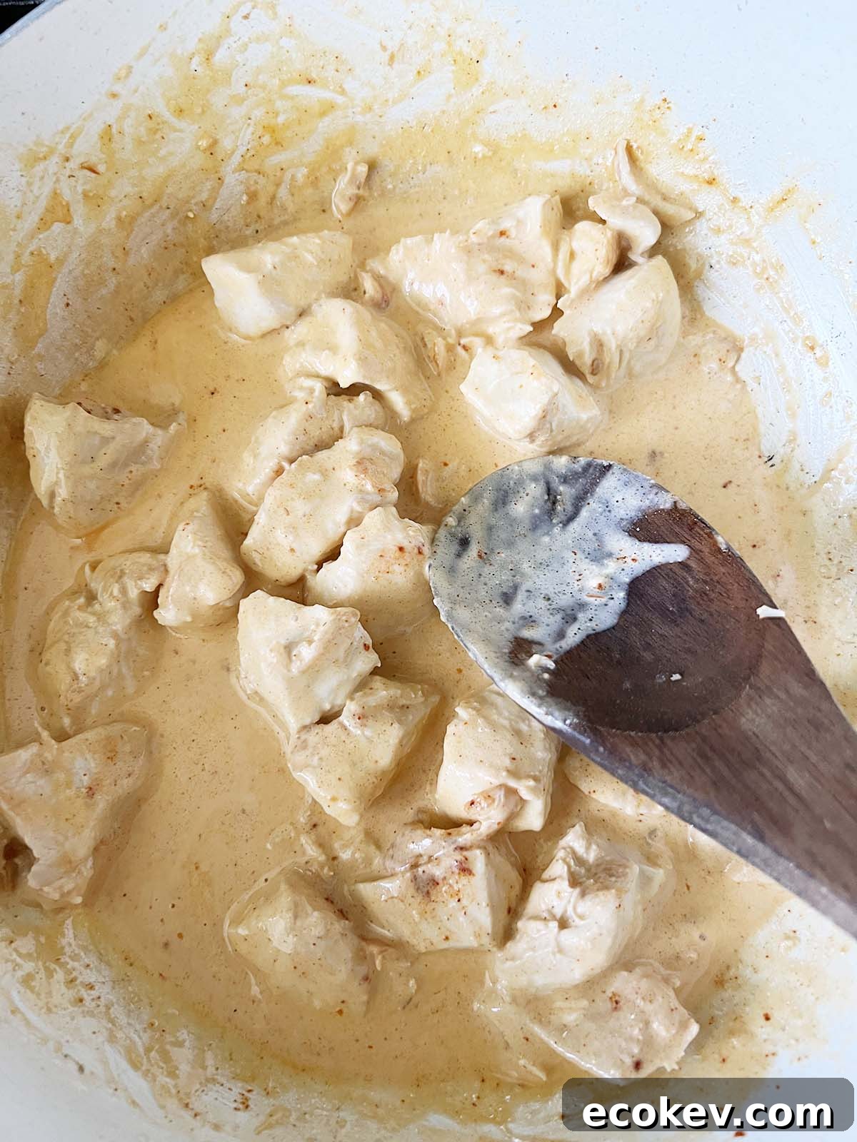 Coating chicken with peri peri sauce