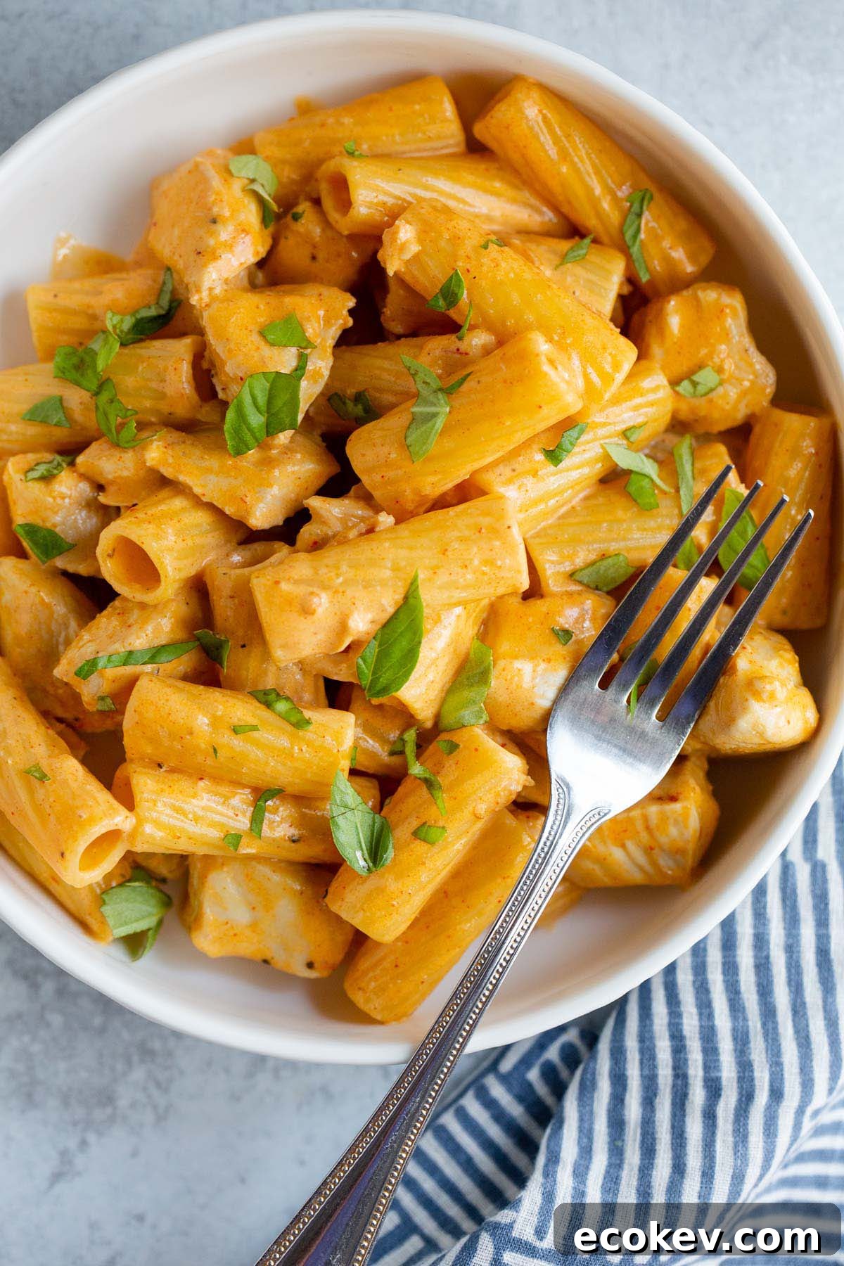 Peri peri pasta in a bowl with a fork