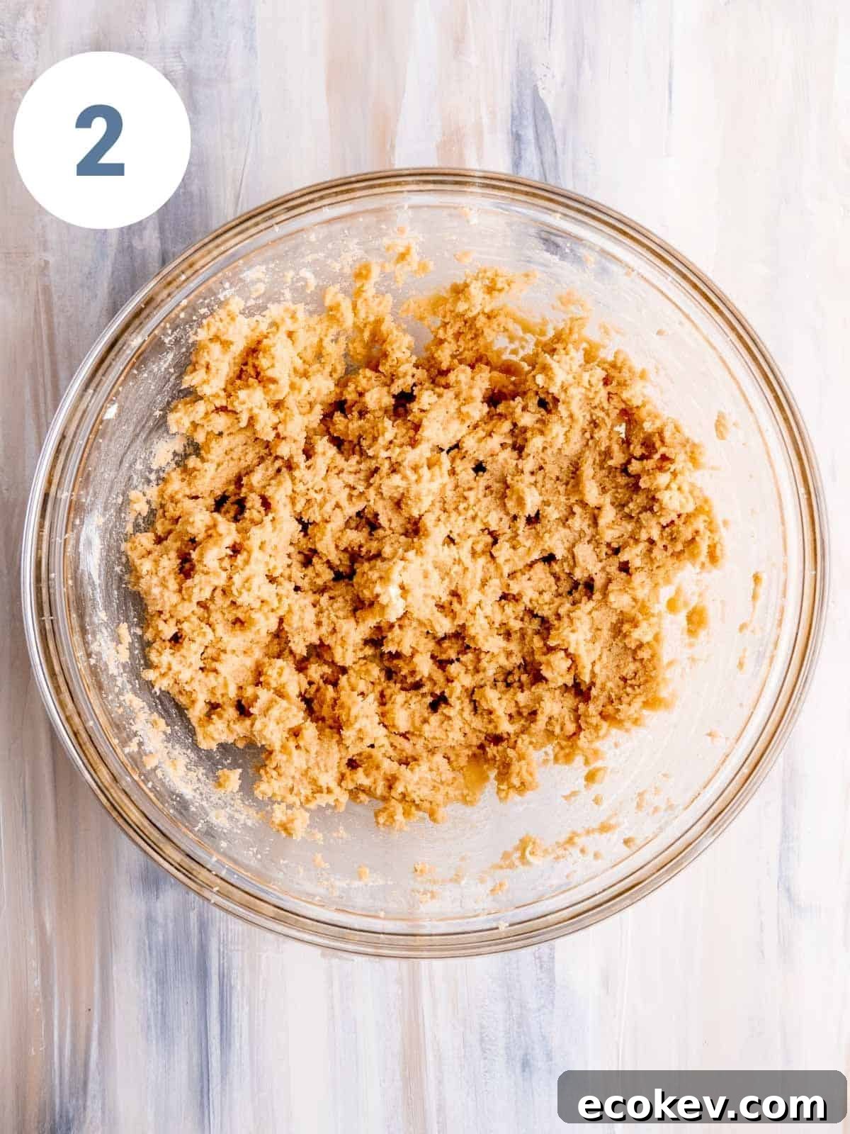 Wet cookie ingredients mixed in a bowl.