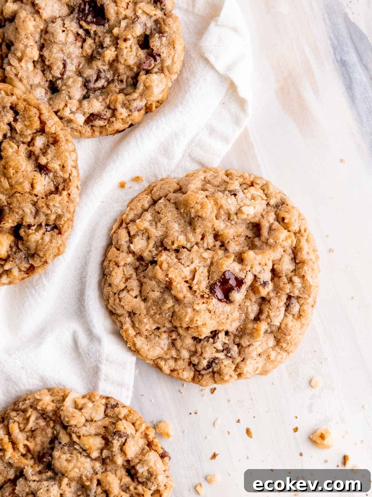 Close up top view of a cowboy cookie with a melted chocolate chunk on top.
