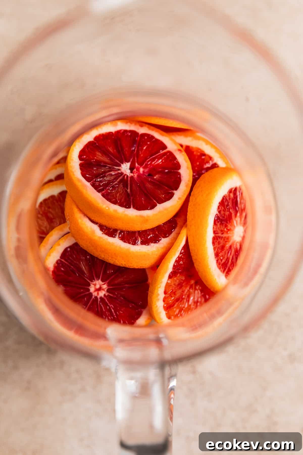 Blood oranges in pitcher, sliced.