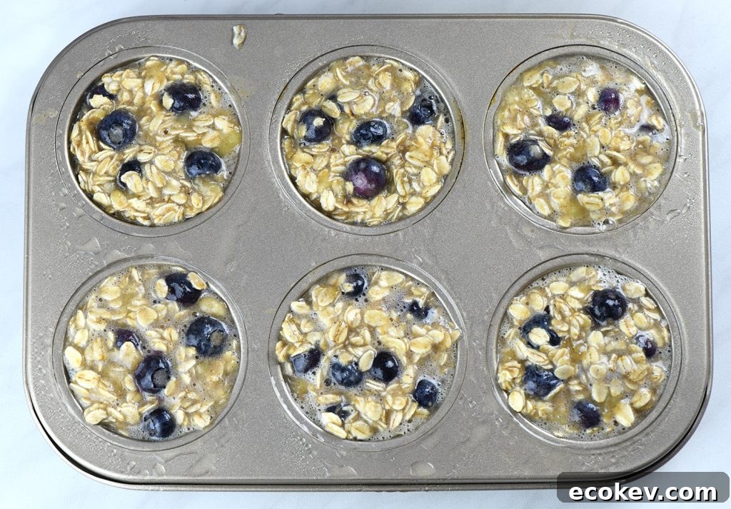 Close-up comparison of Blueberry Banana Baked Oatmeal before and after baking in a muffin tin.