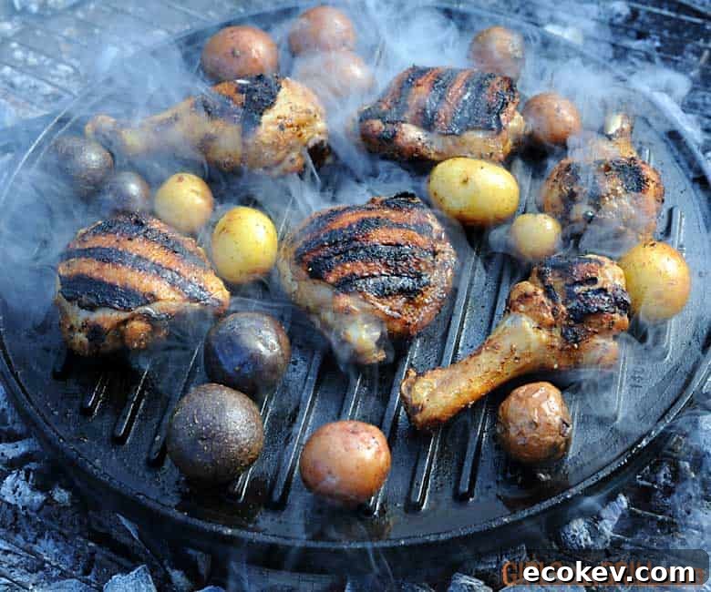 chicken on grill with grill marks and potatoes