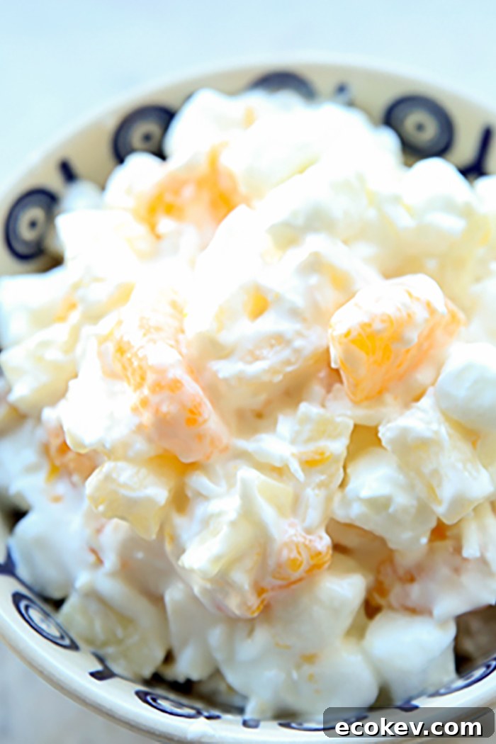 A Polish pottery bowl of Sour Cream Ambrosia Salad.