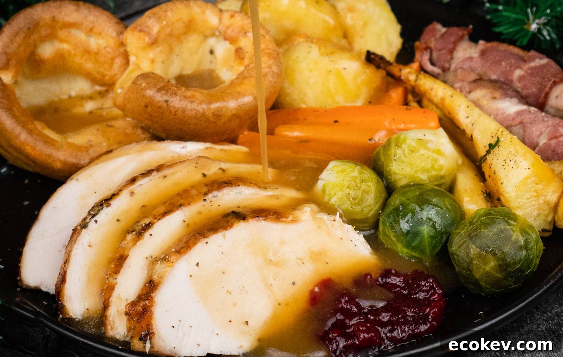 slow cooker turkey slices served with roast potatoes and trimmings