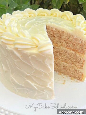 Apple Cinnamon Cake, sliced, on a cake pedestal.