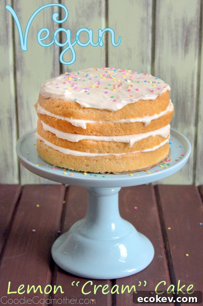 Layers of lemon and cream cheese frosting make this VEGAN lemon cream cake a hit with everyone! Visit GoodieGodmother.com for the recipe