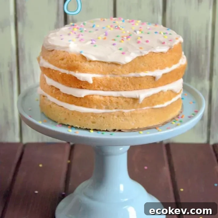 Layers of lemon and cream cheese frosting make this VEGAN lemon cream cake a hit with everyone! Visit GoodieGodmother.com for the recipe