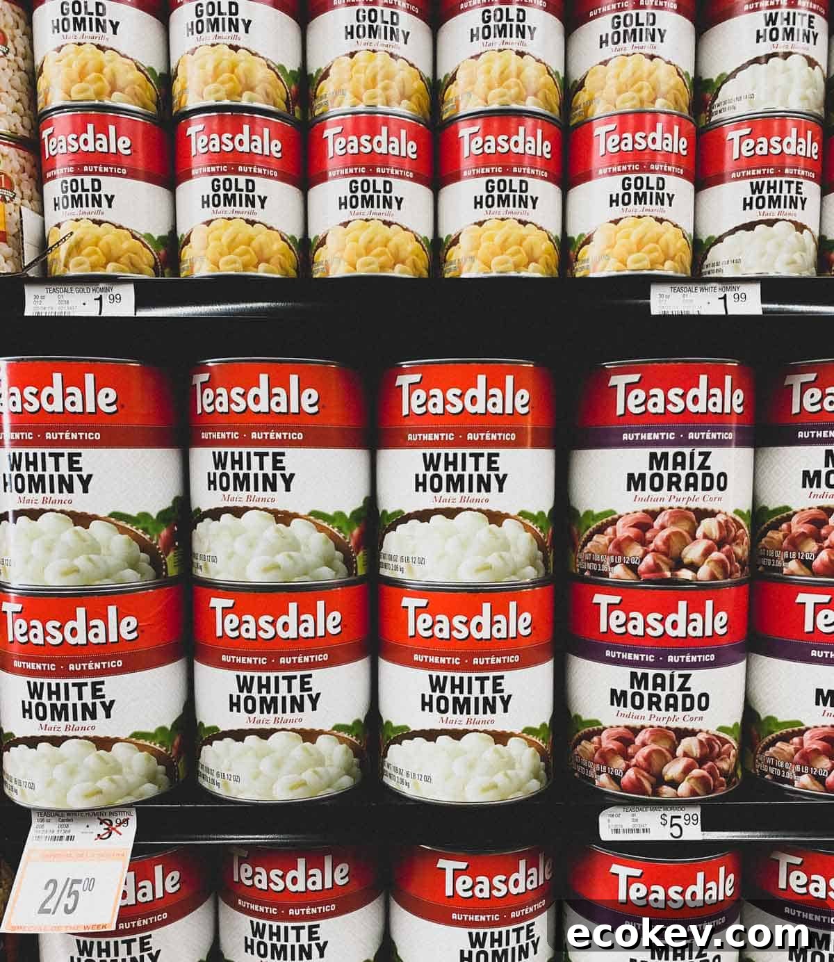 Cans of Hominy corn on a supermarket shelf