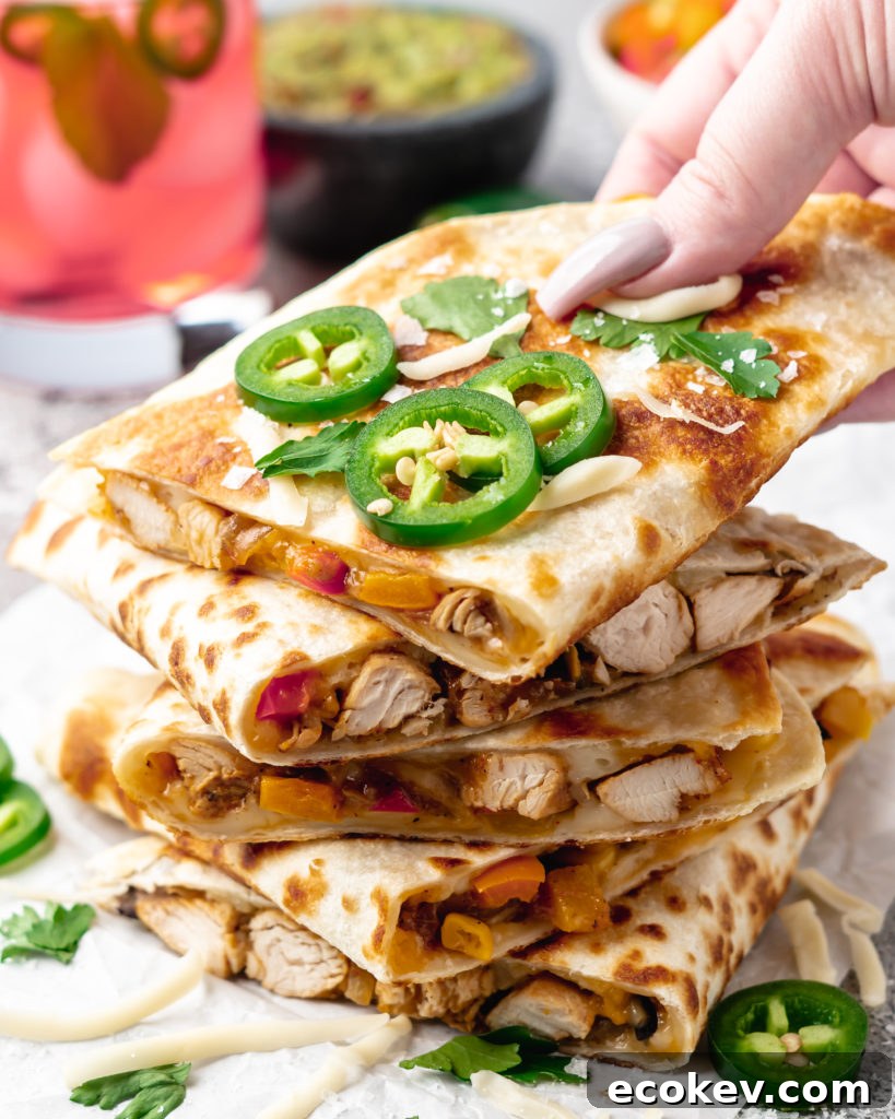 Super crispy quesadillas filled with tropical pineapple lime chicken, monterrey jack cheese, corn, black beans, and peppers