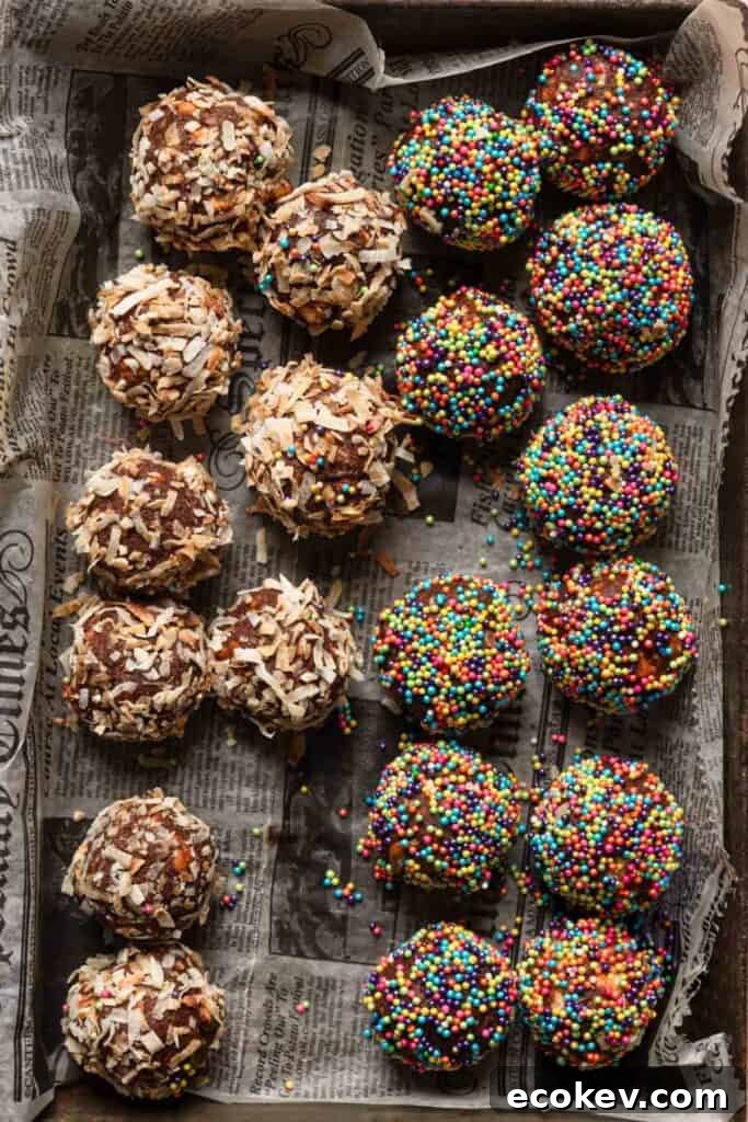 A baking pan with Israeli chocolate balls cookies coated with sprinkles and shredded coconut.