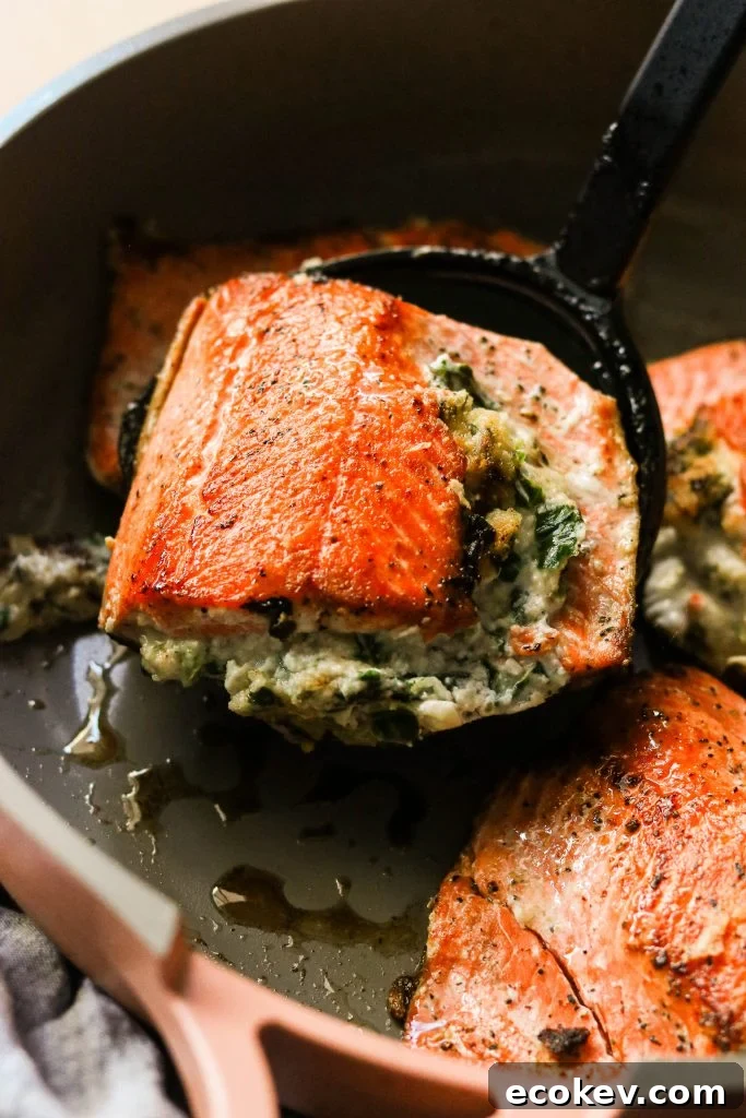 whole30 salmon dinner lifted from the pan with a spatual