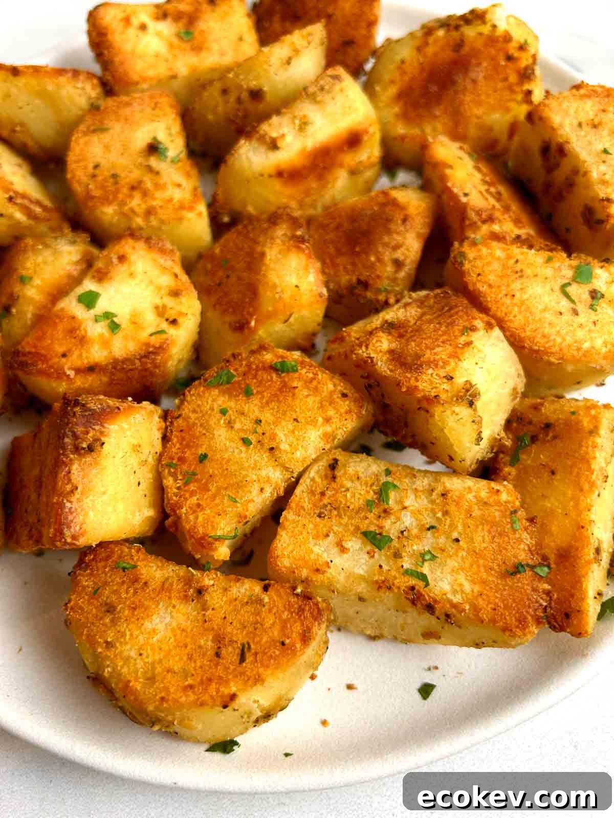 close up of roasted potatoes on plate.
