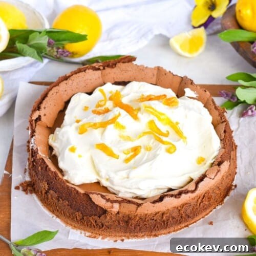 chocolate cake with cream on top on wooden board.