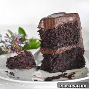upright slice of cake with bite out of it.