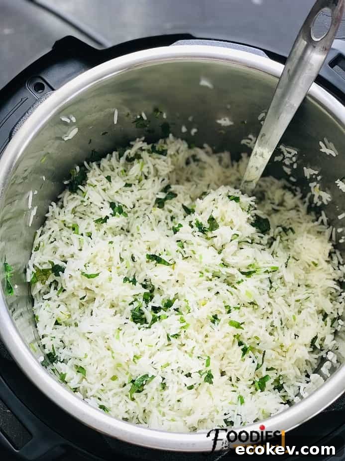 lime cilantro rice instant pot recipe with a steel ladle