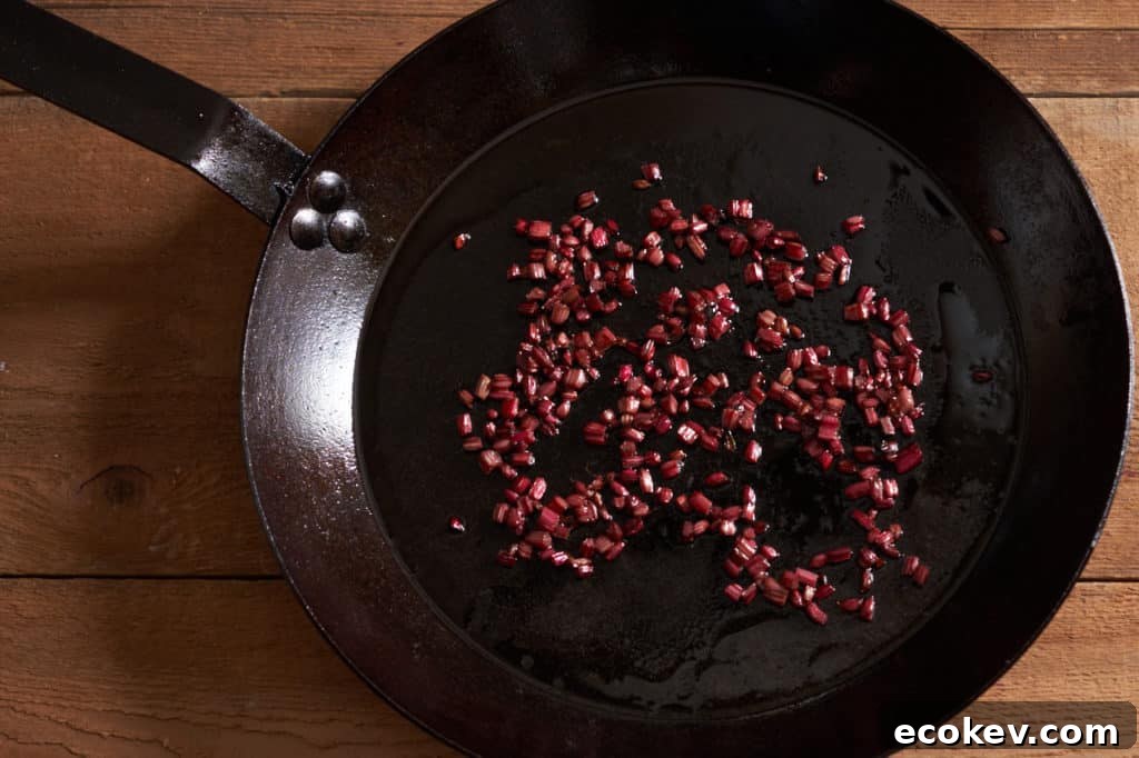 A cast-iron skillet with sauteed beet stems.